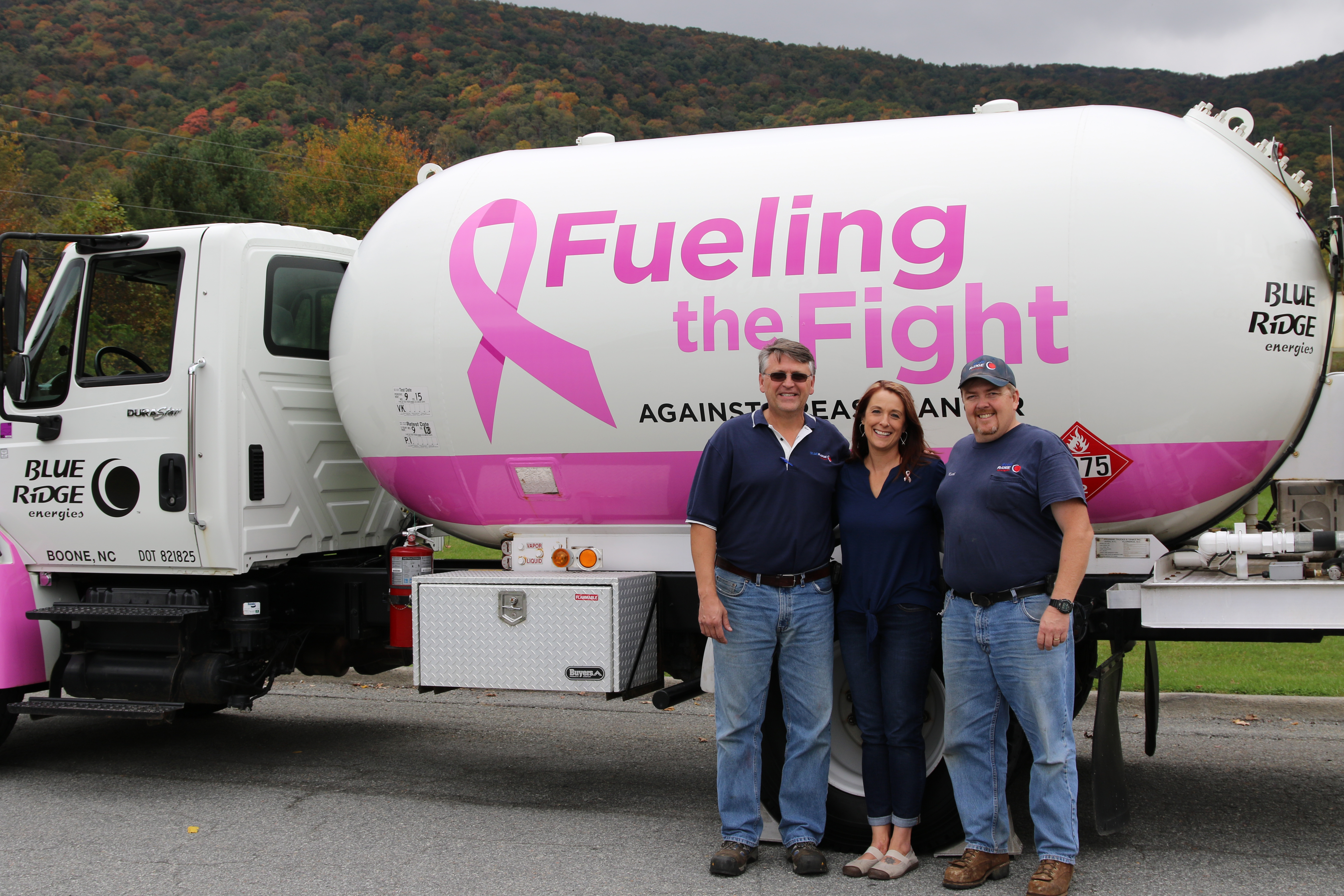 Left to Right: Amy Michael, Kevin Ward, Watauga/Avery District Manager for Blue Ridge Energies and Keith Smith, sales and delivery for Blue Ridge Energies. Amy Michael and Blue Ridge Energies are teaming up during October, which is national breast cancer awareness month. Blue Ridge Energies is donating to cancer support organizations across its service area by giving a penny per every gallon delivered over the past year from its four “Fueling the Fight” propane delivery trucks. Amy, a breast cancer survivor, is Social Worker for Watauga County Schools, Cove Creek and Valle Crucis Schools.