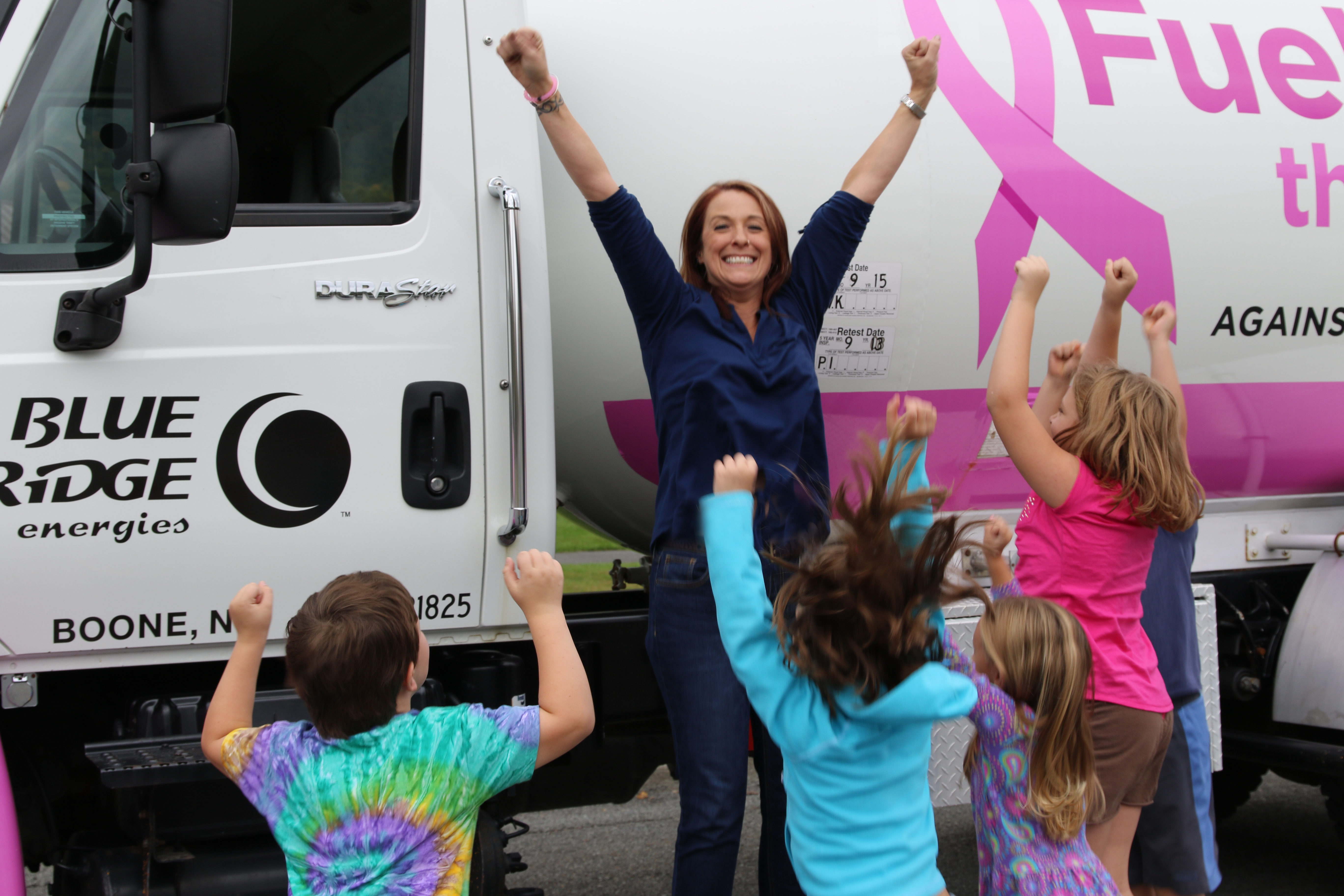 Amy Michael with students at Cove Creek Elementary School and the Blue Ridge Energies Fueling the Fight propane deliver truck.